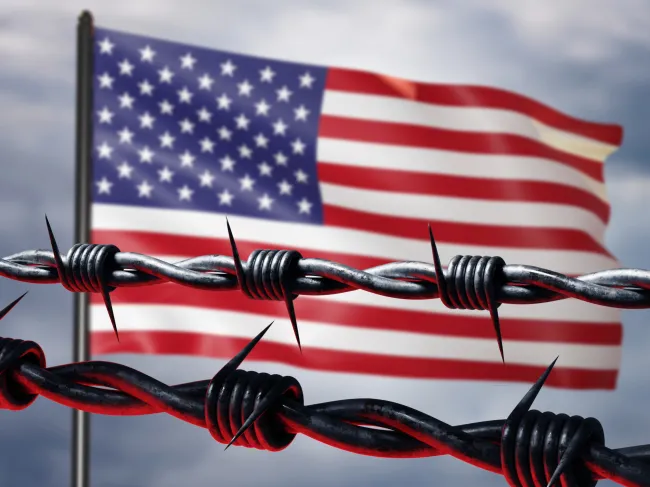 barbed wire and american flag